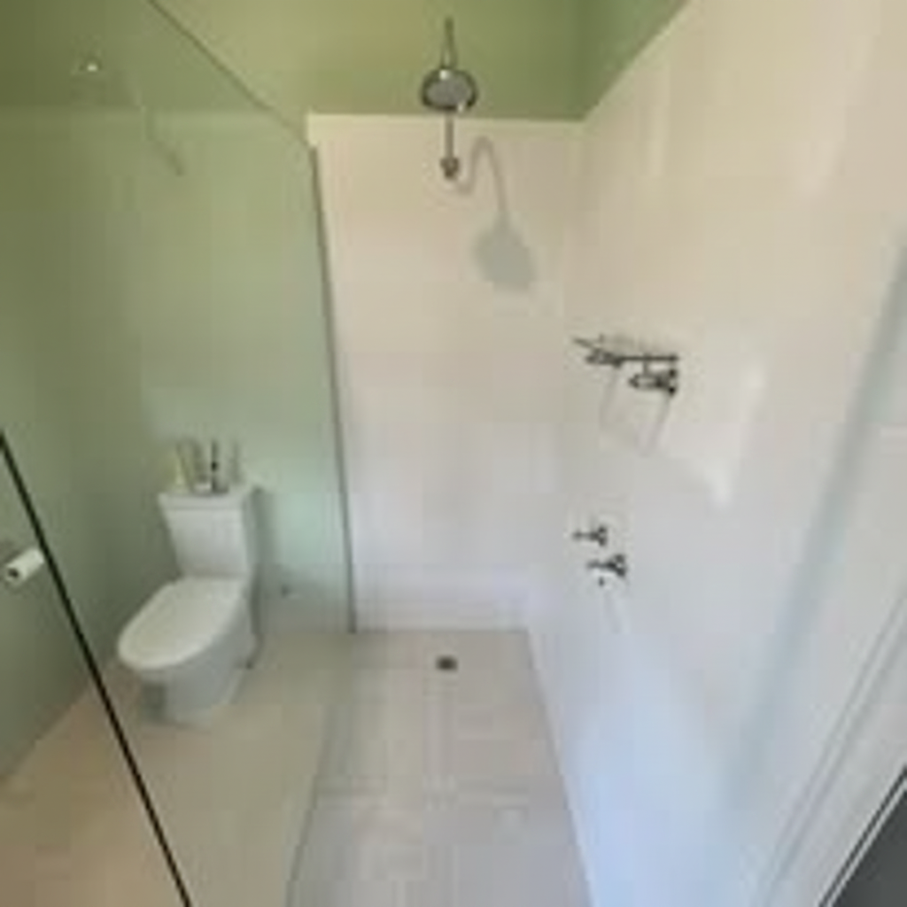 Bathroom wall tiles after — fresh clean white grout